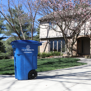 recycling cart in front of house new image